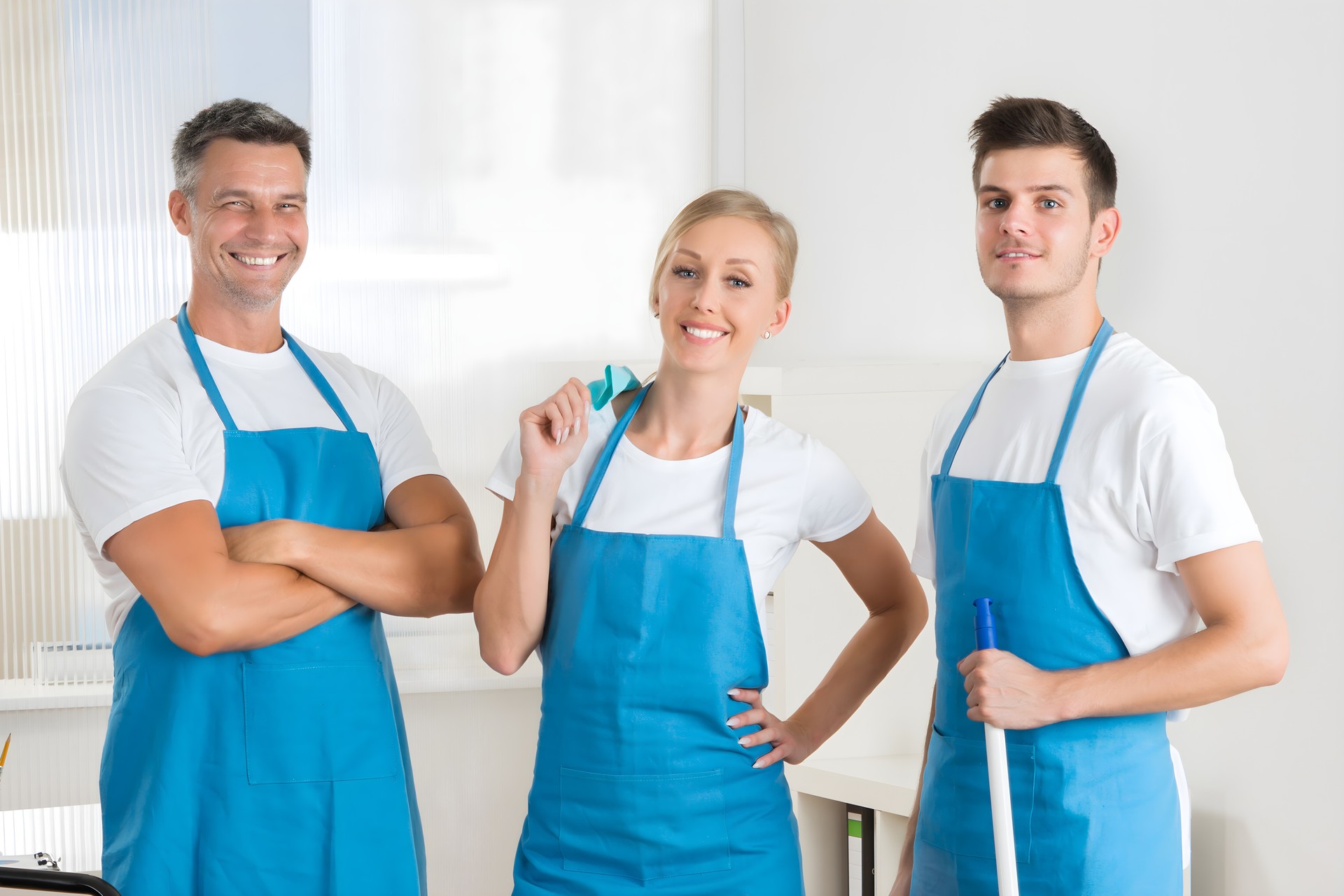 Janitors With Vacuum Cleaner And Cleaning Equipments